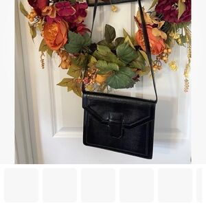 Yves Saint Laurent (YSL) lizard-embossed leather bag